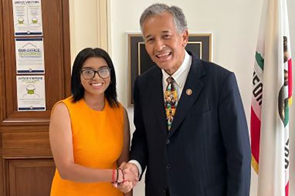 Senior Emily Martinez-Villalobos and U.S. Rep. Juan Vargas of California