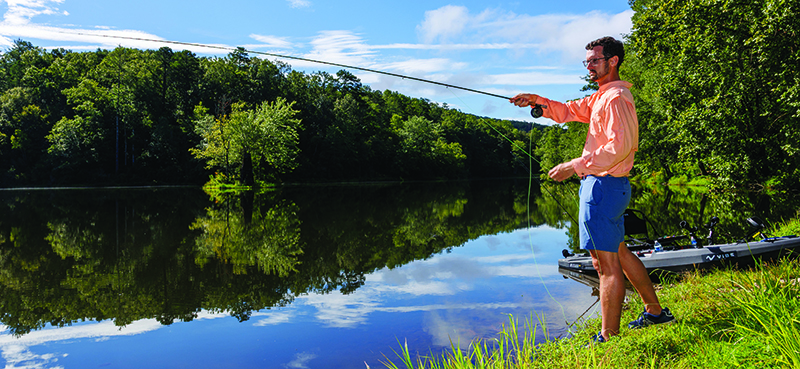 312A9950.CR3 Dawson Jordan fishes at the side of a lake