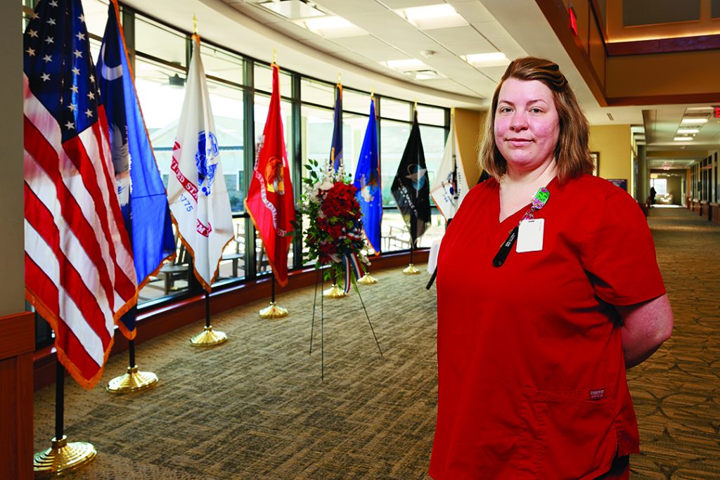 312A5734.CR3 Kayla Marsden stands in the lobby of the Palmetto Patriots Homes in Gaffney